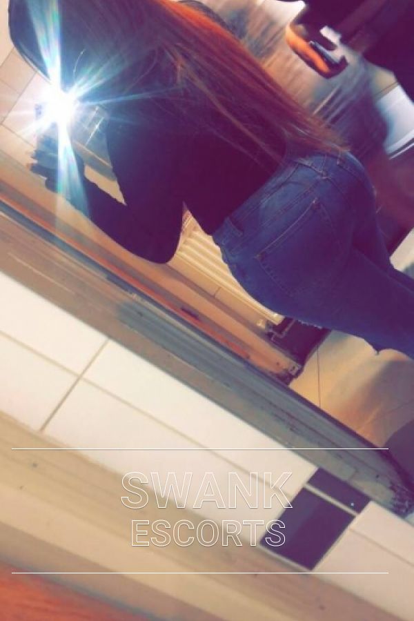 Sian taking a mirror selfie showing off her big bum in tight jeans and black top