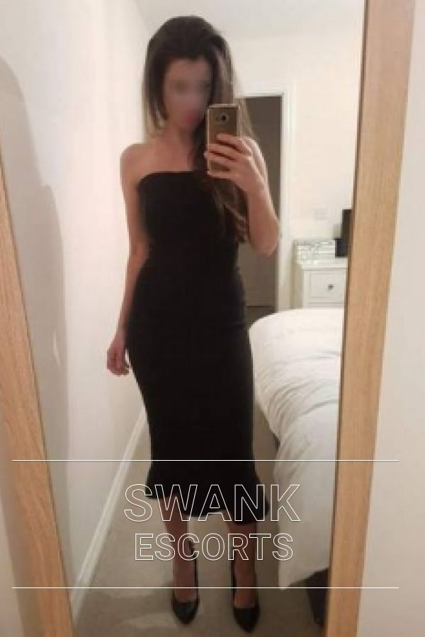 Jessica taking a selfie in a sexy black dress